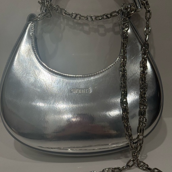 The one & only @HUDA carries our bestselling LUNA bag in  Giarite’ Silver Metallic Luna Hobo Bag